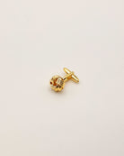 Manschettenknöpfe in gold einzeln liegend