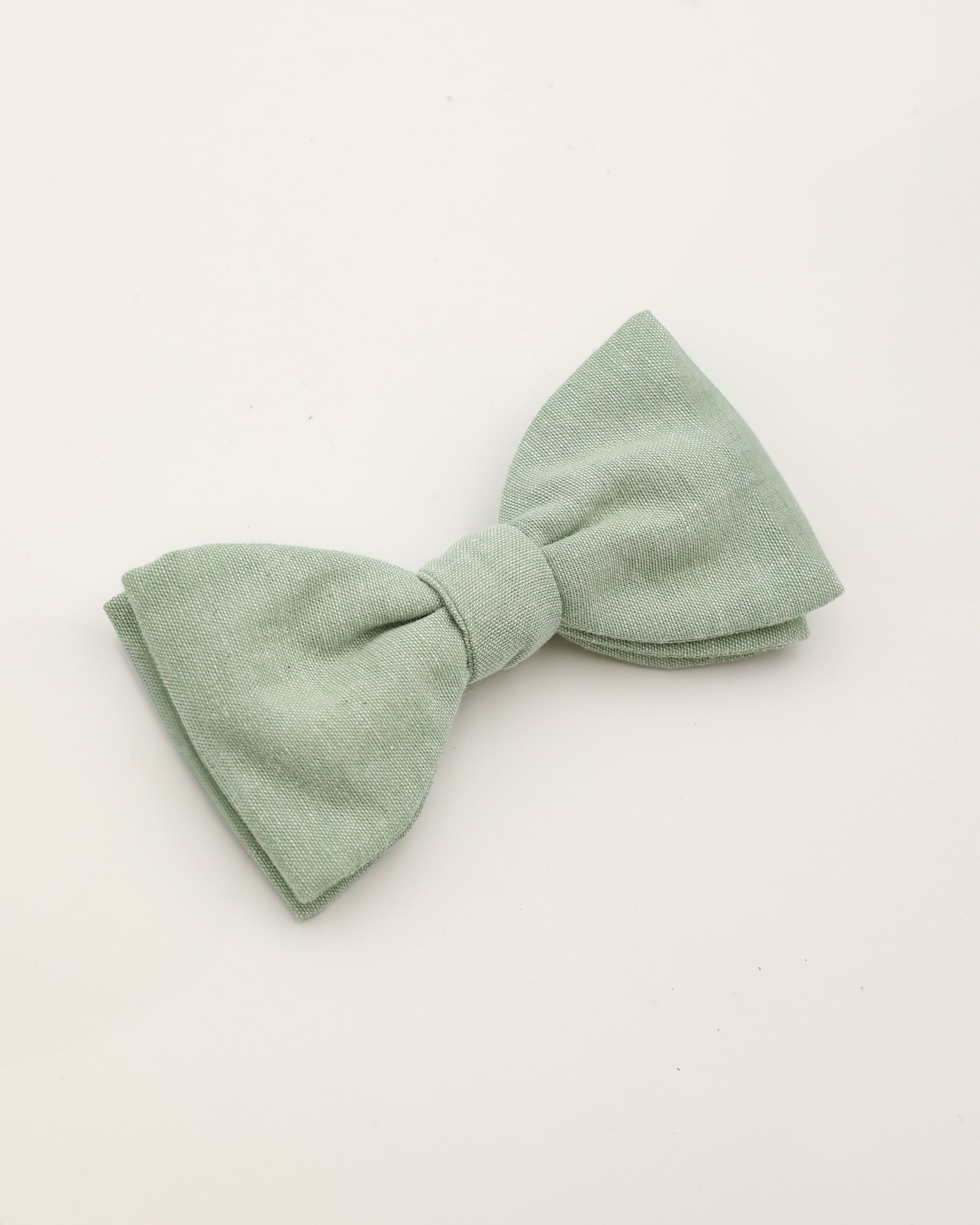 Schleife aus Leinen und Baumwolle in apfelgrün liegend
